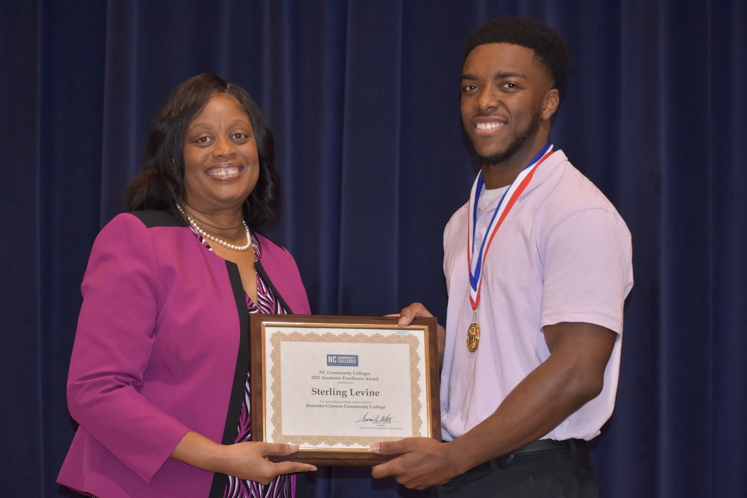President Murray J. Williams presents North Carolina Community College Academic Excellence Award to Sterling Levine.