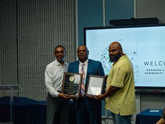 Andre’ Lassiter, R-CCC Foundation Board Chair and Chair of the Hertford County Board of Commissioners (left), was joined by Commissioner Leroy Douglas II (right), to present Gatling a plaque and county resolution on behalf of the Hertford County Board of Commissioners for his dedicated work on the college’s trustee board.